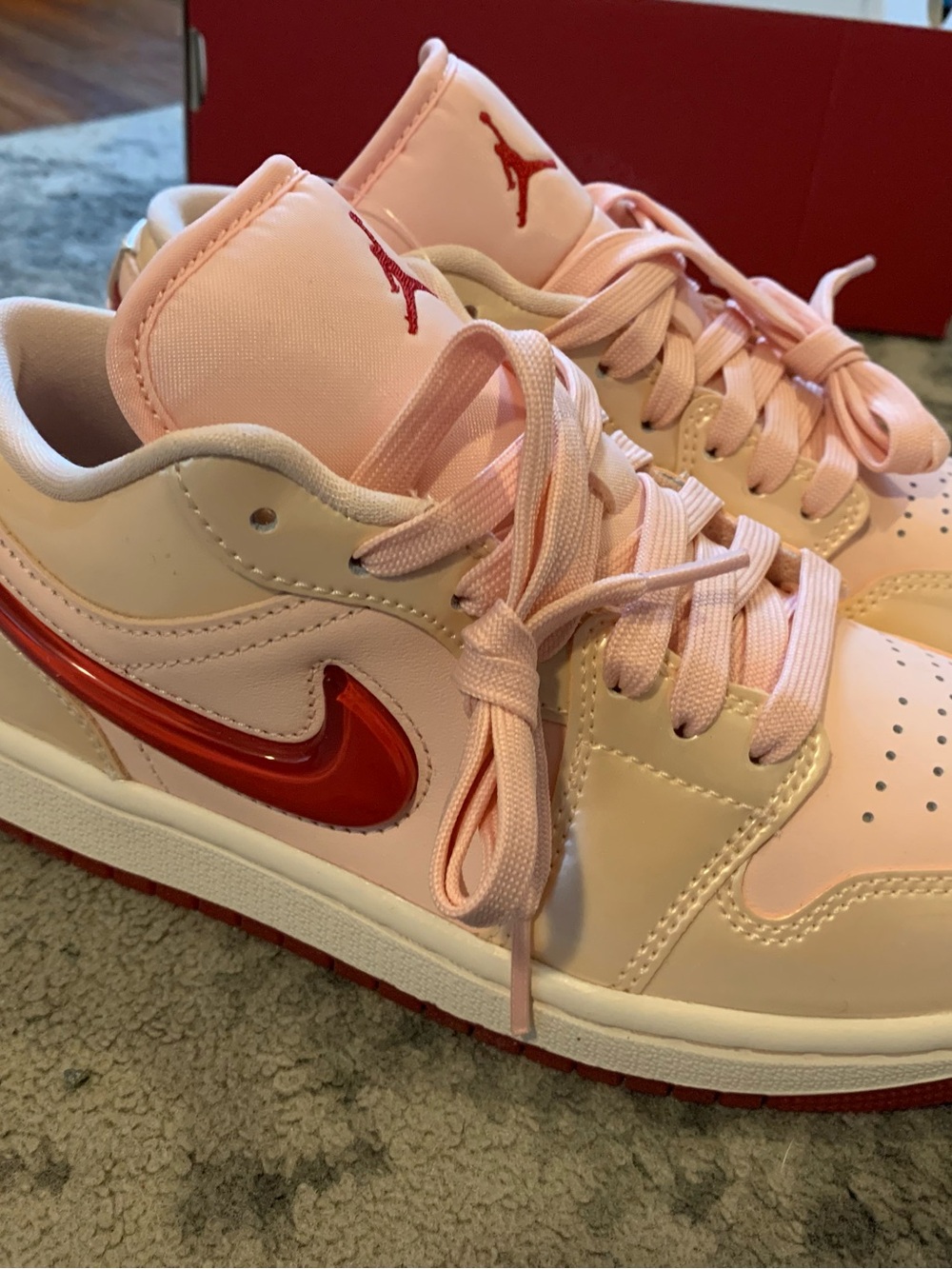 Jordan Low-Top Sneakers in Light Pink with Red Swoosh